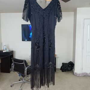 Black sequins detailed dress with fringes at the bottom